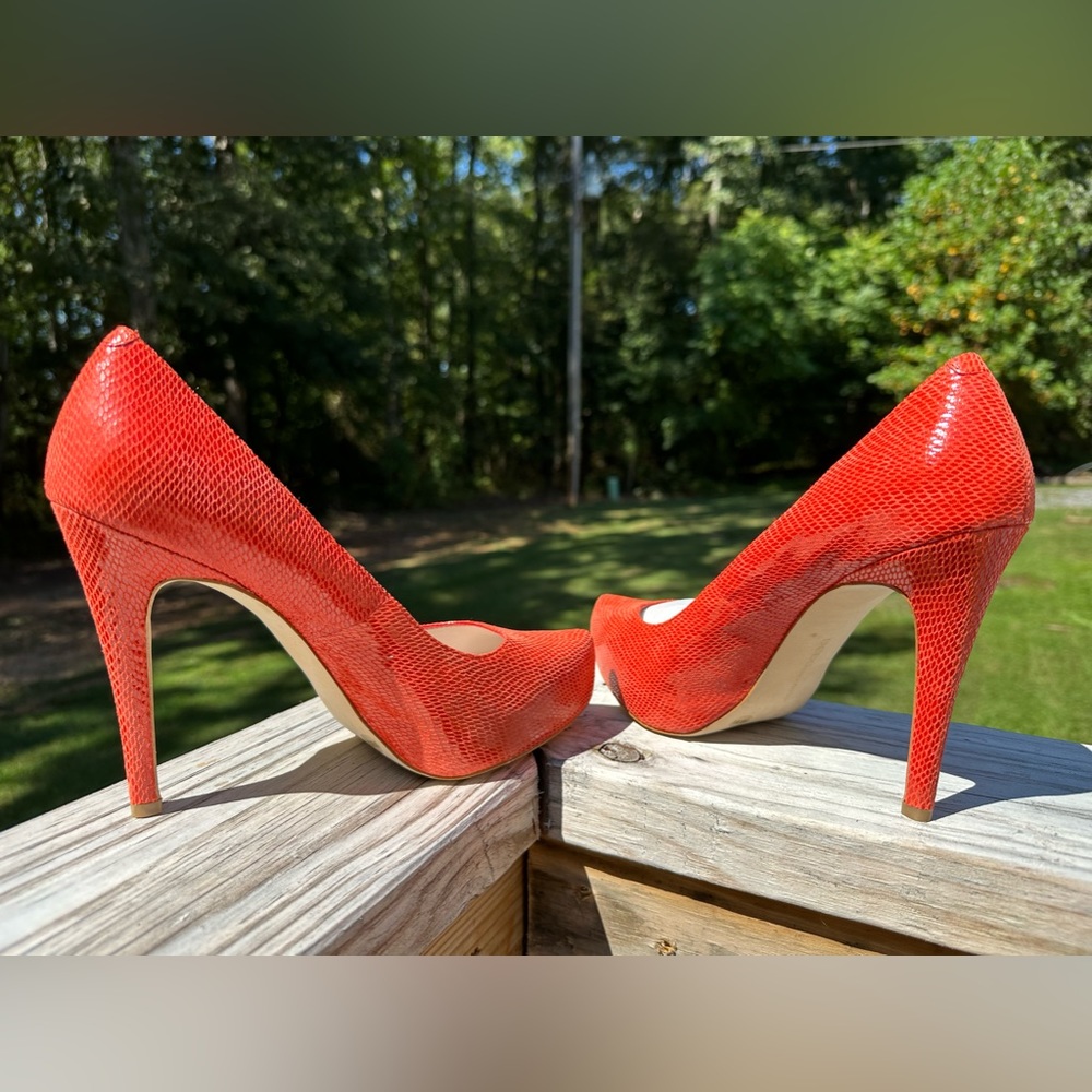 BCBGeneration Lucey orange Women
Platform Pumps Round Toe Slip-on..